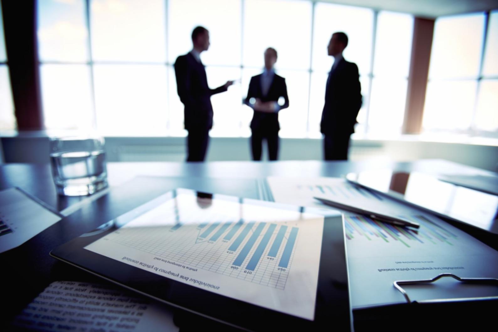 Financial professionals analyzing market data and investment strategies